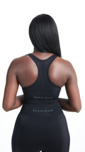 Back view of Black Shavo Seamless Bra. Bra has Roam Loud logo centered on back of bra.