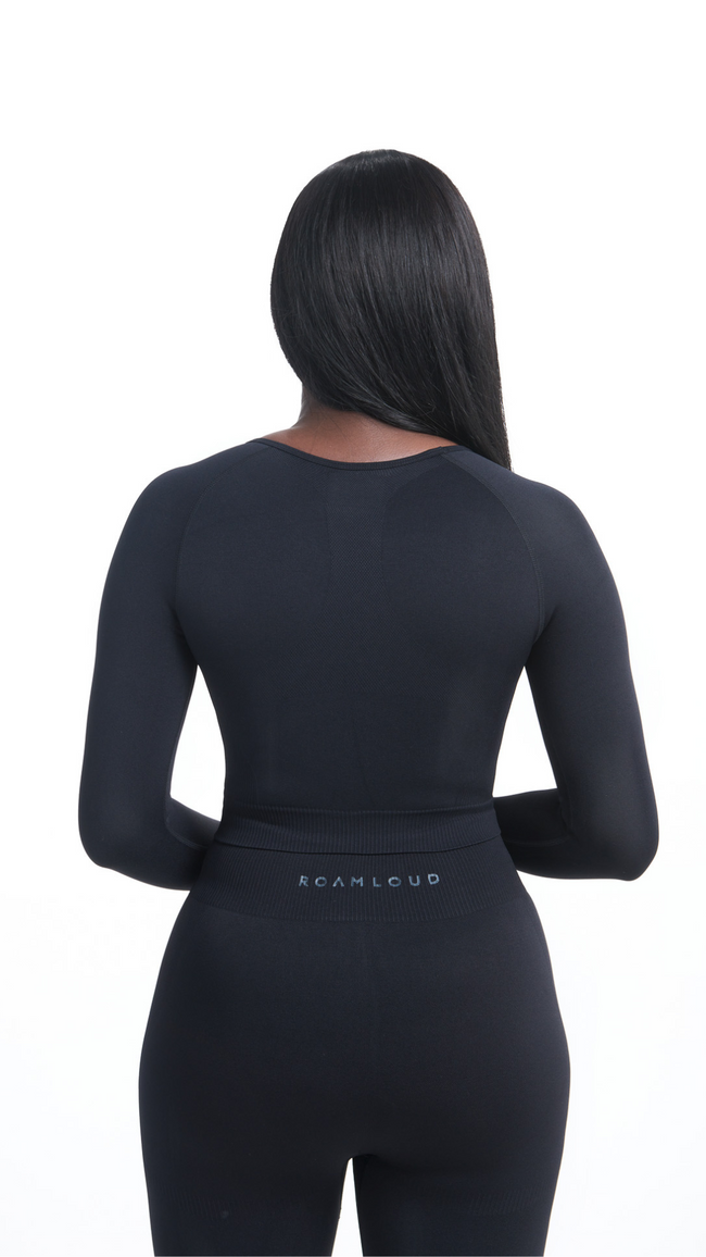 Back view of Black Shavo Long Sleeve Top. Matching black Shavo seamless legging pictured. Legging has monochrome black Roam Loud logo centered on back.