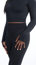 Close front view of Black Shavo Long Sleeve Top. Matching black Shavo seamless legging pictured.
