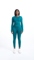 Full front view of woman wearing a turquoise Shavo Long Sleeved Top. Matching Shavo legging pictured.