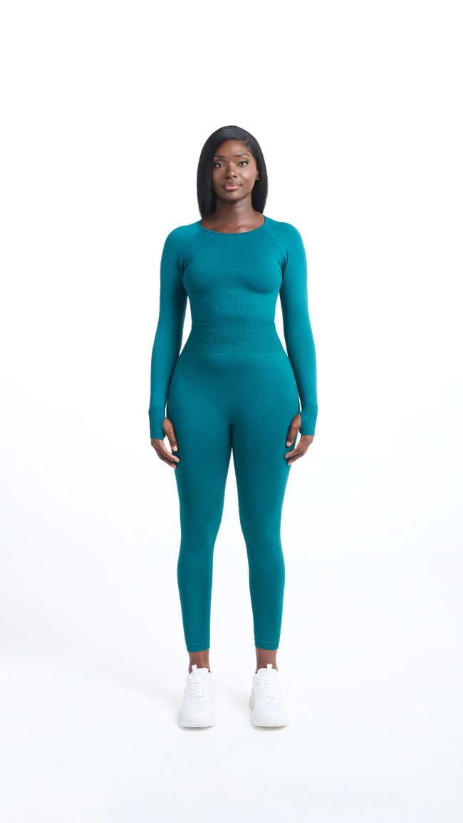 Full front view of woman wearing a turquoise Shavo Long Sleeved Top. Matching Shavo legging pictured.