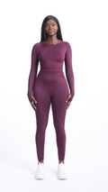 Full front view of woman wearing a purple Shavo Long Sleeved top. Matching legging is also pictured.
