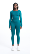Full view of woman wearing a Turquoise Shavo legging. Matching Shavo Long Sleeved top is also pictured.