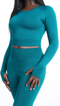 Close front view of turquoise Shavo Long Sleeve Top. Matching turquoise Shavo seamless legging pictured.