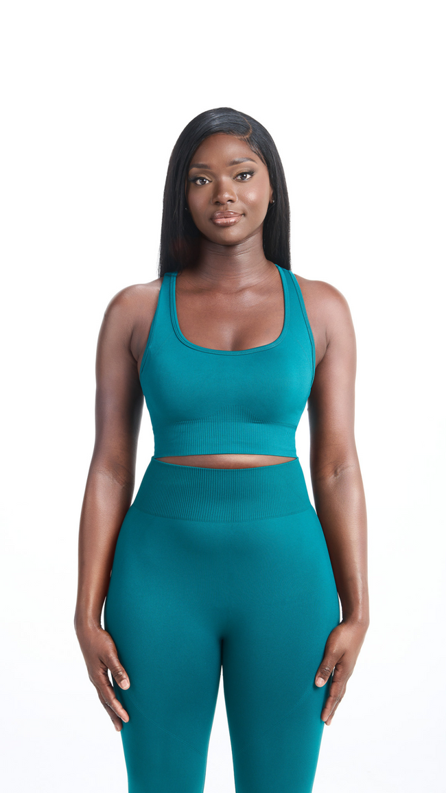 Front view of Woman wearing a green colored seamless bra