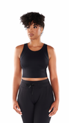 Woman wearing a Black Yanta Tank Bra. Full coverage support for intense workouts.
